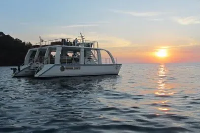 Catamaran on the Pacific Ocean at sunset