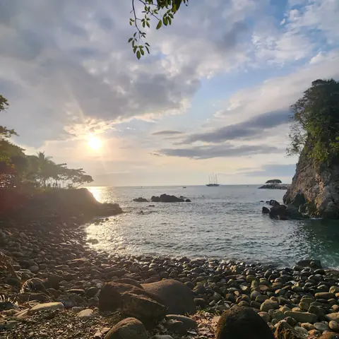 Sunlight over a rocky cove on the Pacific coast