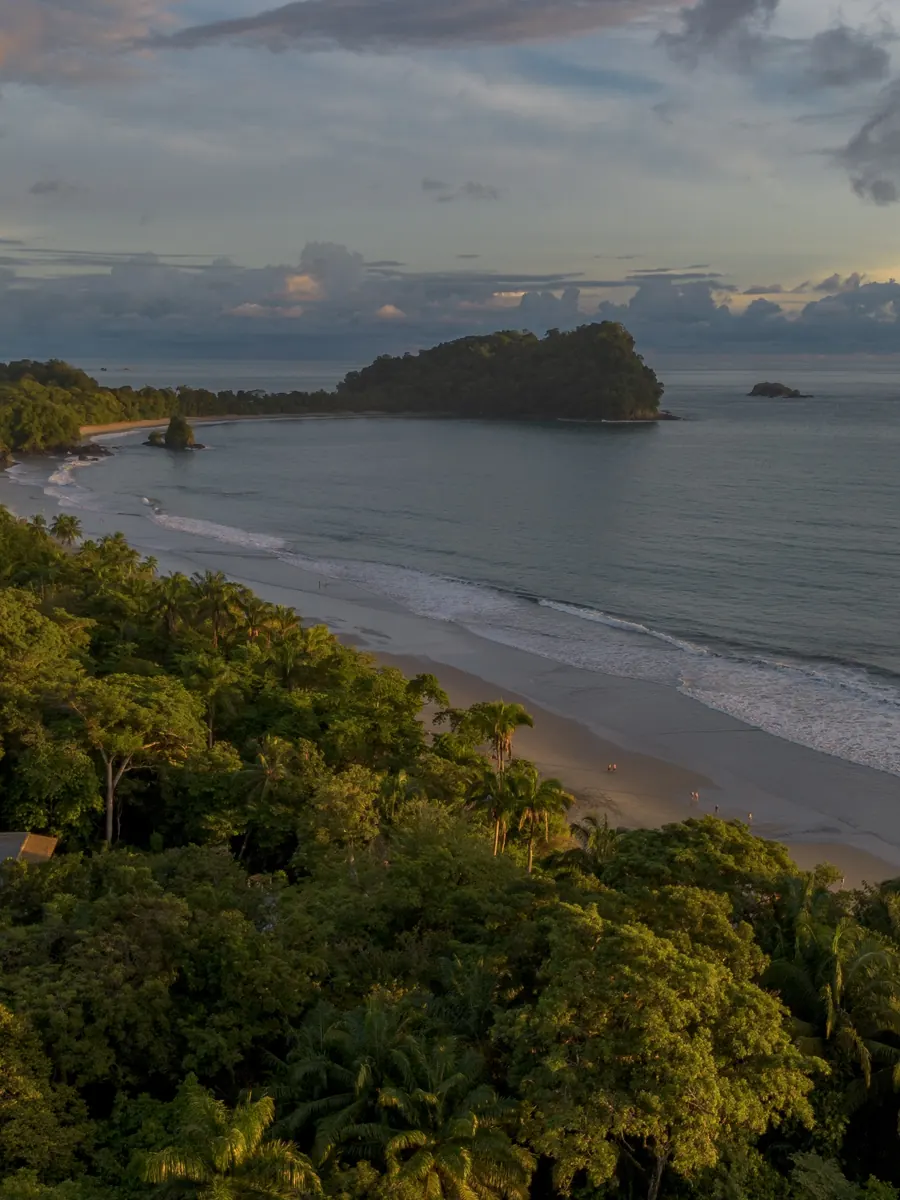 Aerial view of the beach in Manuel Antonio, with rainforest meeting the Pacific Ocean